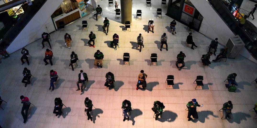 Periods of social distancing might be necessary into 2022 to avoid overwhelming hospitals, Harvard researchers say