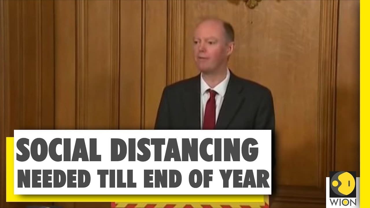 UK chief medic: Social distancing likely for next year